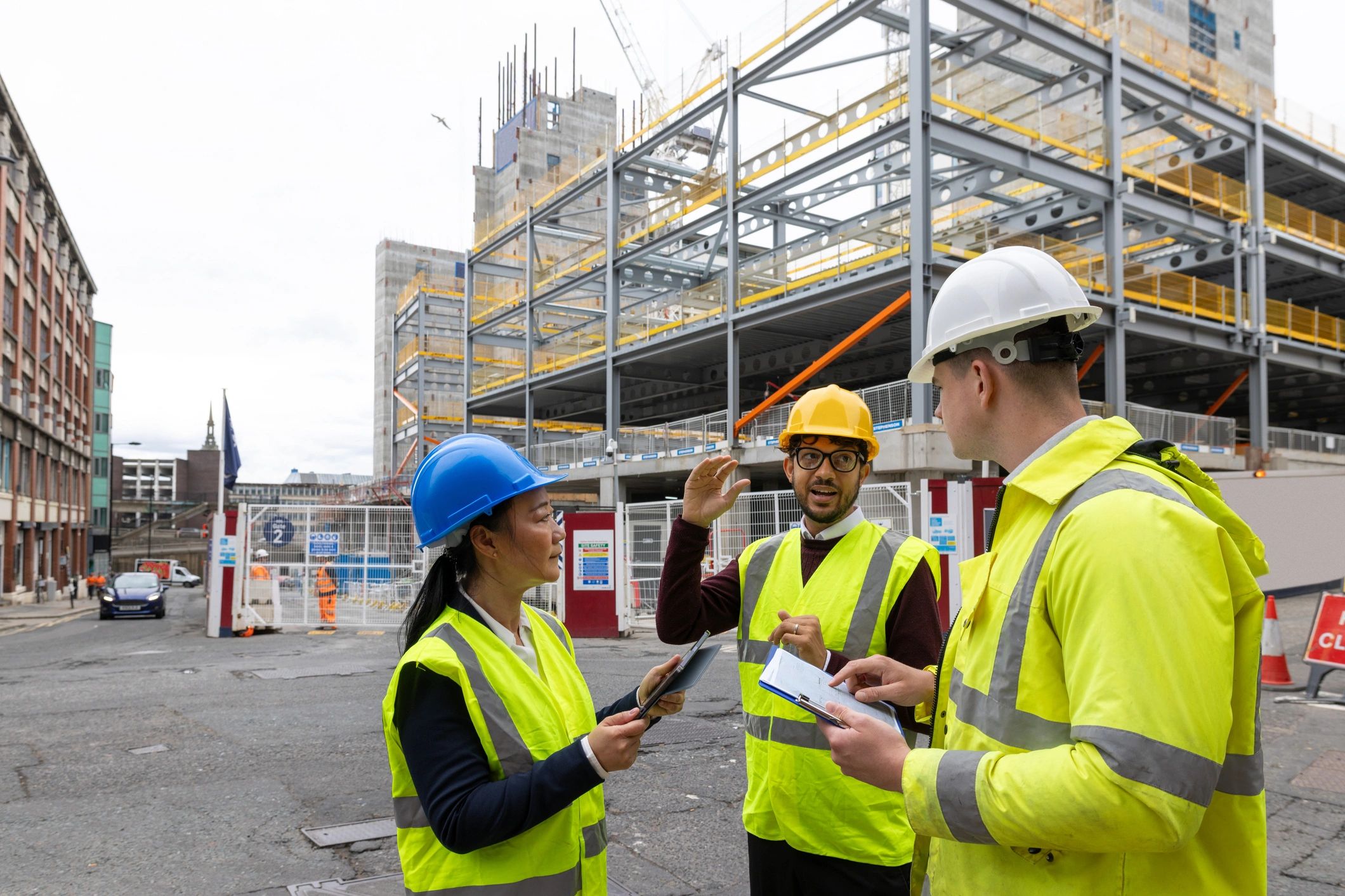 Construction professionals reviewing plans on site